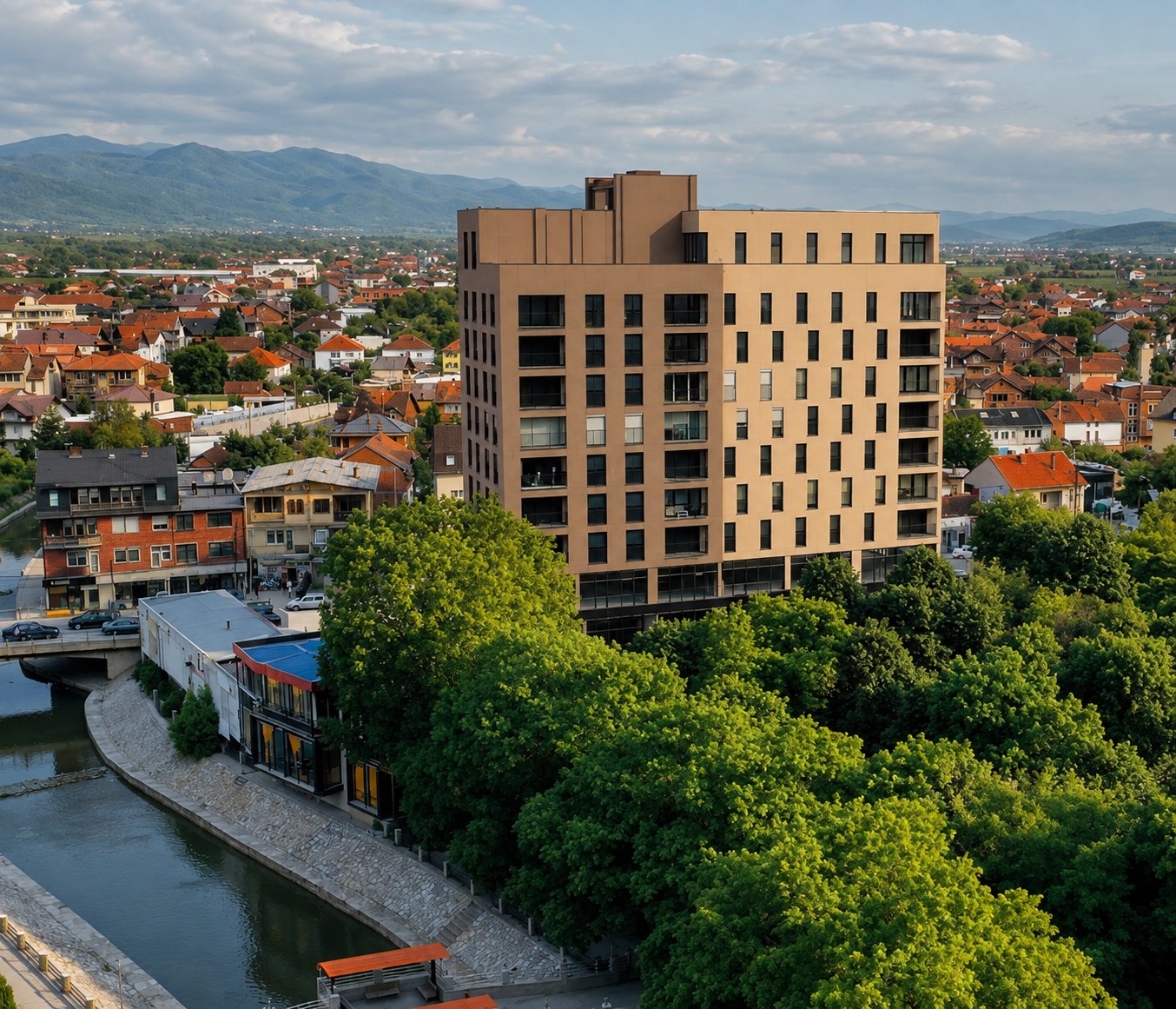 Beni Dona Center, an aerial view of the completed tower above the riverside in Podujeva