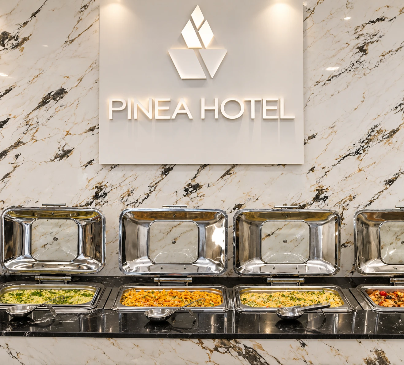 The "Pinea Hotel" sign above the breakfast buffet stations