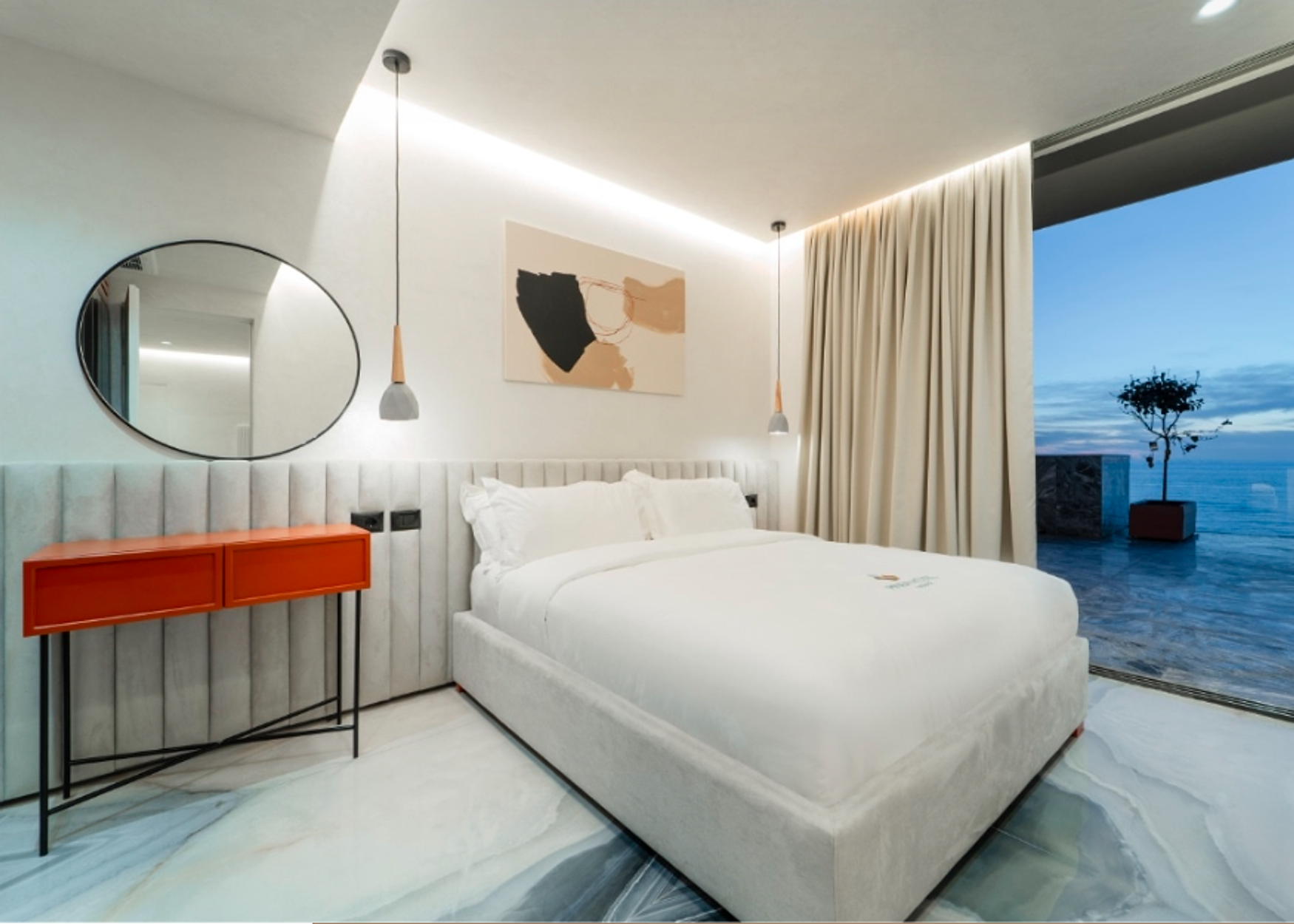 A Hotel Pinea Grand Suite, channel-tufted headboard beside a terrace over the Adriatic