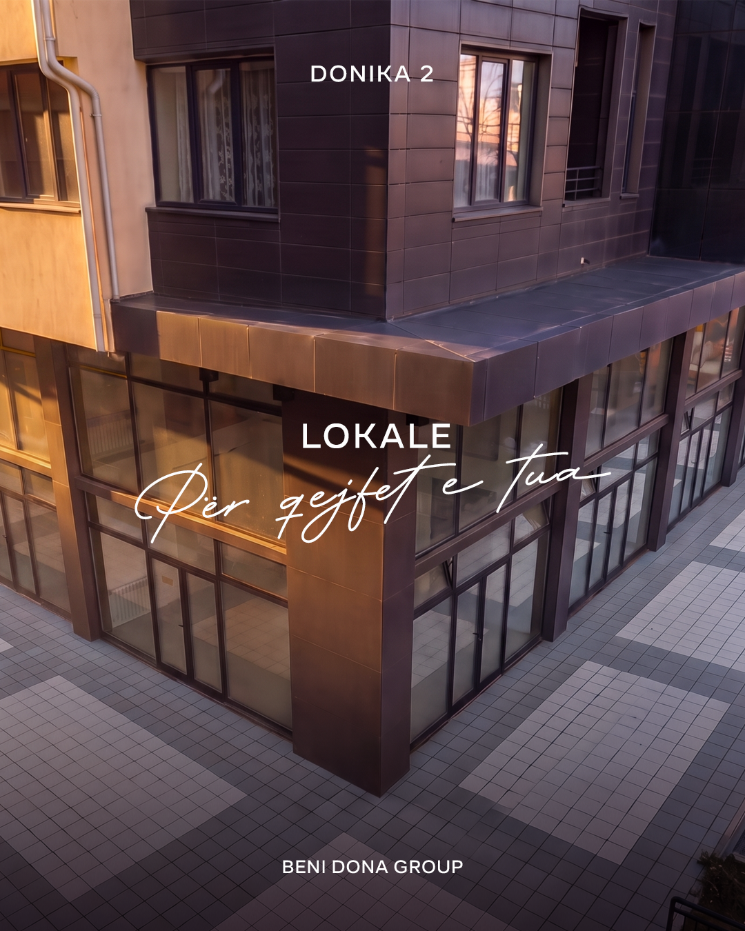 A ground-floor commercial unit at Donika 2, glass storefront at dusk