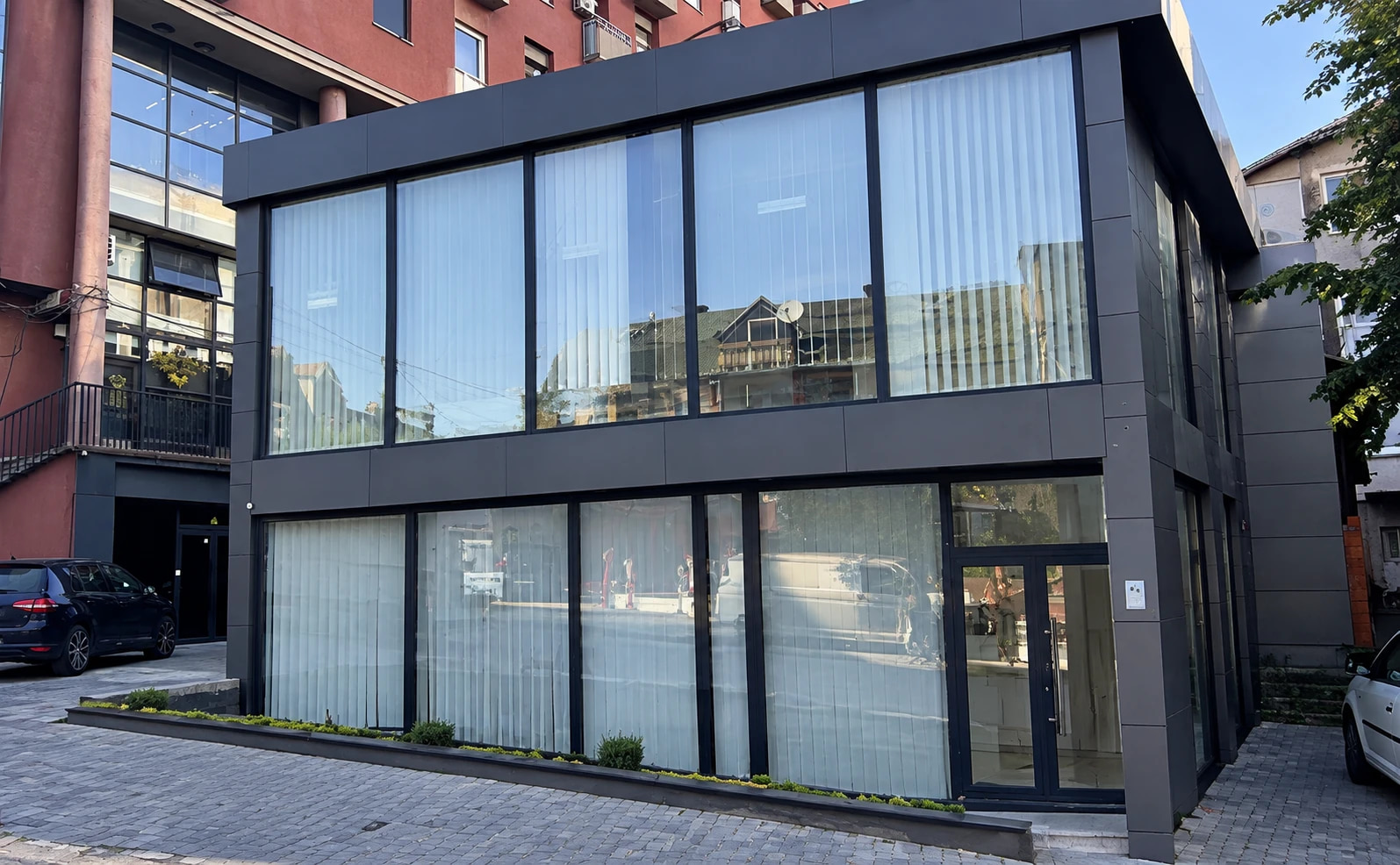 A two-storey glass-fronted retail unit for rent in Ulpianë